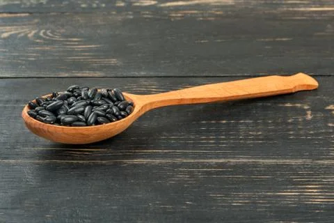 Black beans in spoon Stock Photos