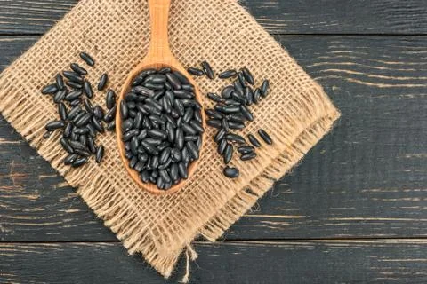 Black beans in spoon Stock Photos