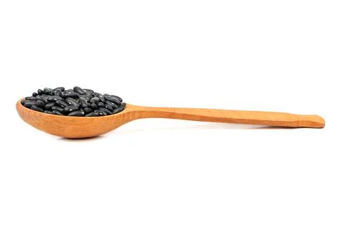 Black beans in spoon Stock Photos