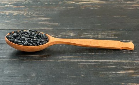 Black beans in spoon Stock Photos