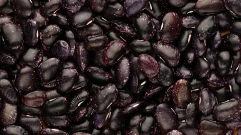 Black beans with white spots, top view. Video stock 137319930
