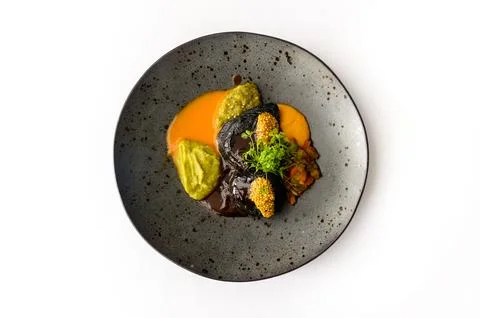Black beef steak with roasted pumpkin cream isolated Stock Photos