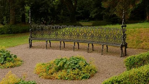Black bench in the garden Stock Photos