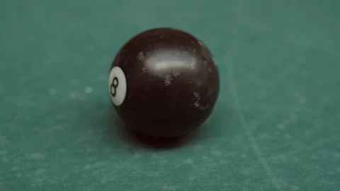 Black billiard 8 ball close up on green pool table Stock-Footage 343697405