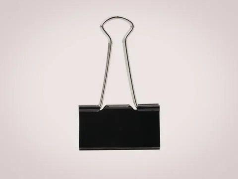 Black binder clip on white background for office supplies Stock Photos