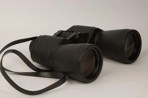 Black binoculars on a white background Stock Photos