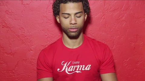 Black, biracial, Hispanic young man meditates, brings hans up together Stock Footage 40776319