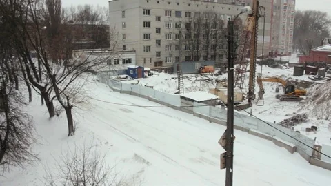 Black bird flies in winter construction Stock Footage 71222234