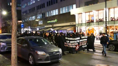 Black bloc making the finger to camera Stock Footage 105350440
