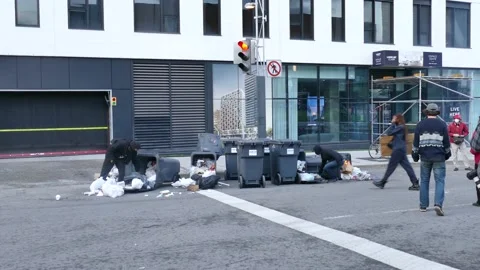 Black bloc trying to put fire in garbage Stock Footage 132556122