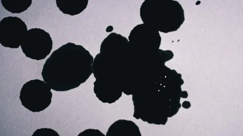 Black Blots Fill the White Background with Drops Close-up Stock Footage 255391567