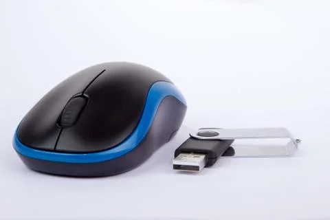 Black blue computer mouse with an usb stick Stock Photos