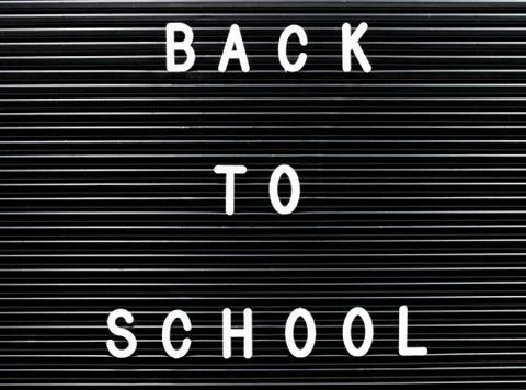 A black board with the text: Back to school. Stock Photos