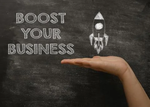 Black board with the text Boost your business Stock Photos
