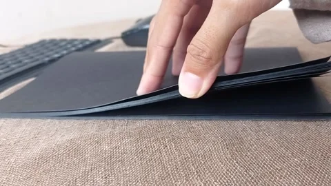 A black book on a brown table Stock Footage 146246813