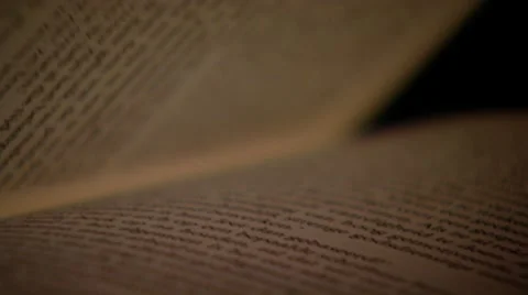 Black book in dark environment. Sequence Stock Footage 8696076