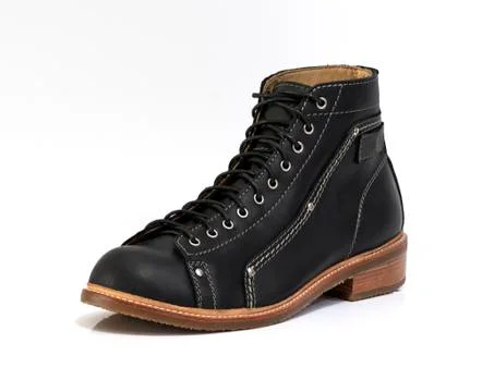 Black boot isolated on white background. Fashion advertising photos. 库存照片