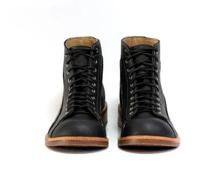 Black boot isolated on white background. Fashion advertising photos. 库存照片