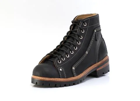 Black boot isolated on white background. Fashion advertising photos. Stock Photos