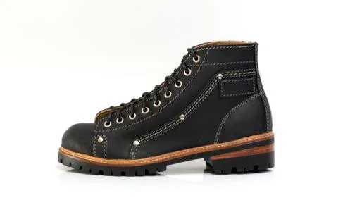 Black boot isolated on white background. Fashion advertising photos. 库存照片