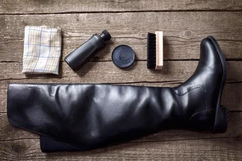 Black boot, polish cream, brush and cloth Stock Photos
