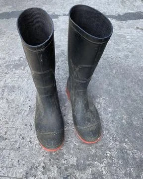Black boots on the floor front angle Stock Photos