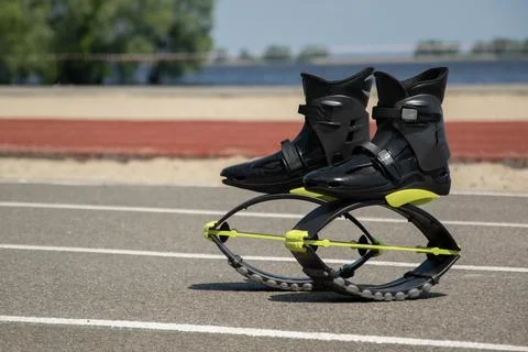 Black boots for jumping on a blurred background of nature. Kangoo jumping Stock Photos