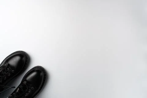 Black boots on a white background. Copy space Stock Photos