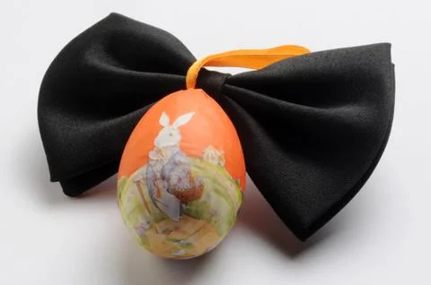 Black bow tie with easter egg Stock Photos