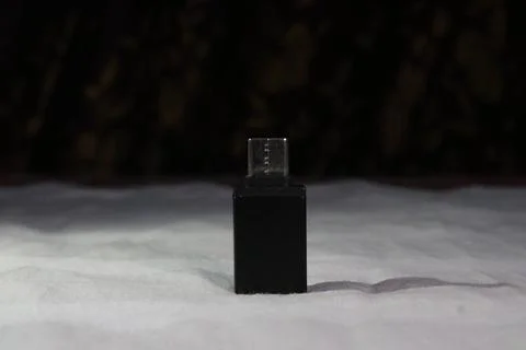 Black box with clear plastic or glass on top standing on snowy surface in d.. 写真素材