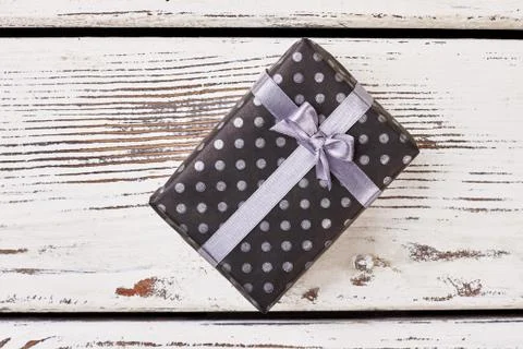 Black box with violet bow. Stock Photos