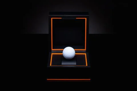 Black box with white golf ball. Stock Photos