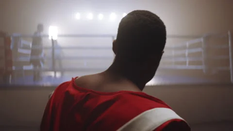 Black boxer in red robe approaching the ring Stock Footage 282986410