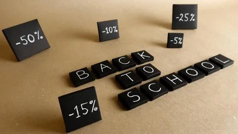 Black boxes displaying Back To School and discount percentages Stock Photos