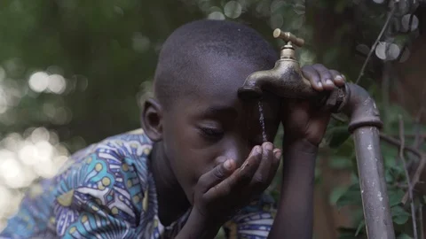 Black Boy Drinking Stock Footage 97063390