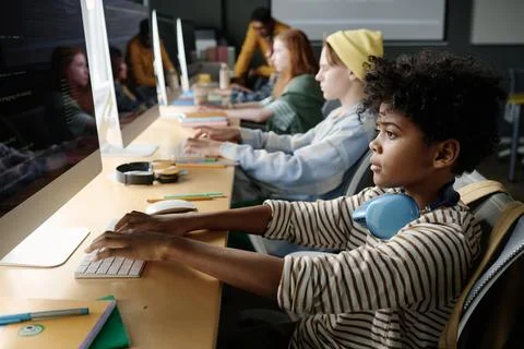 Black Boy Focused On Coding In Class Stock Photos