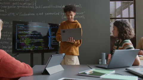 Black Boy Presenting Programming Task on Screen to Classmates and Teacher Stock Footage 318717855