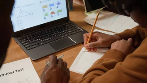 Black Boy Solving Geometry Problem with Fathers Guidance Stock Footage 334962367