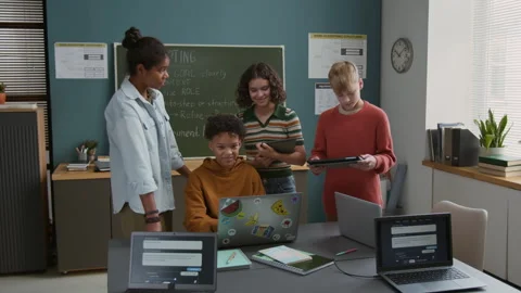 Black Boy Working on AI Project and Classmates Watching Stock Footage 318721613