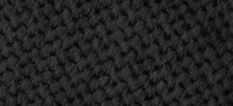 Black braided material with an interesting pattern Stock Photos