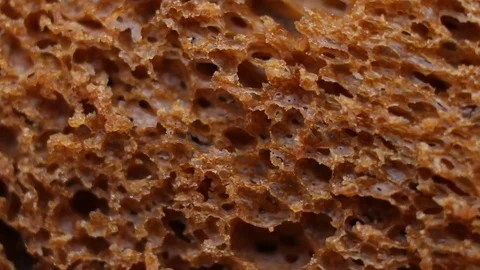 Black bread background, macro shot Stock Footage 83476649