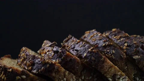 Black bread on a black background Stock Footage 150876628