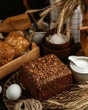 Black bread covered with seeds Stock Photos