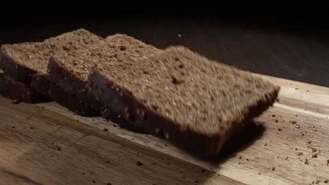Black bread falls on the cutting board Stock Footage 170163658