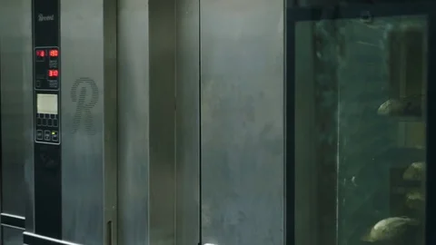 Black bread lies in oven Stock Footage 76886912