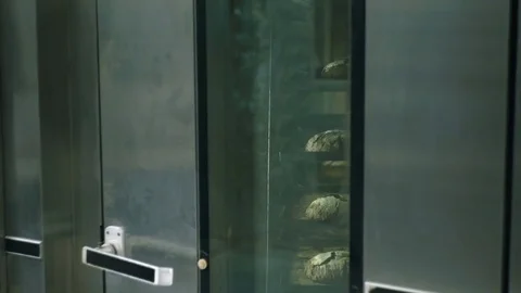 Black bread in the oven Stock Footage 76890557