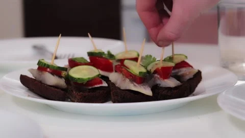 Black bread sandwiches with fish Stock Footage 168641957