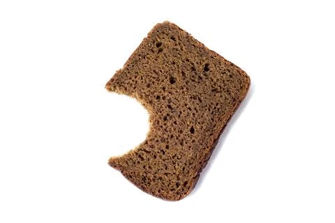 Black bread slice bitten, isolated on white background Stock Photos