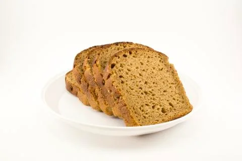 Black bread sliced on a plate Stock Photos
