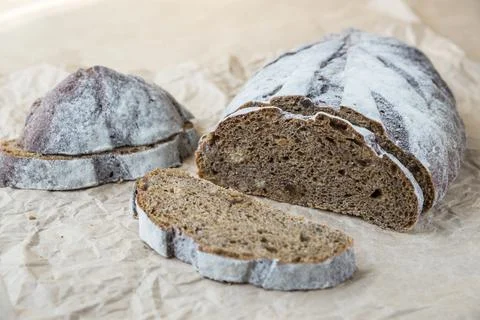 Black bread with walnuts and raisins Stock Photos